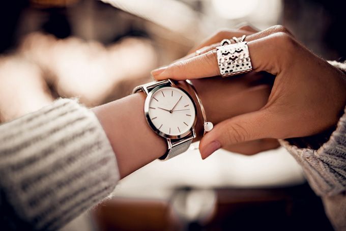 Coursera data science: a woman looking at her watch.